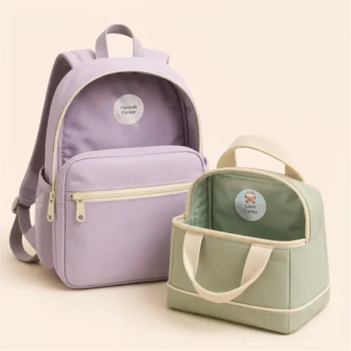 Personalized name labels on a backpack and an insulated lunch bag