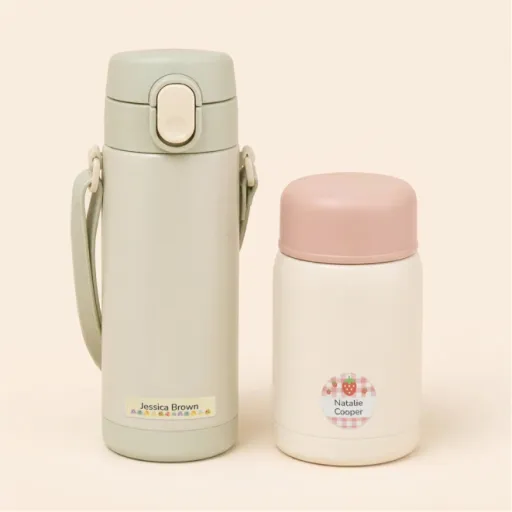 Personalized name labels on a water bottle and thermos