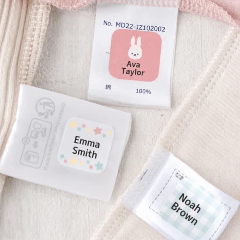 Name labels pressed onto woven care tags inside children’s clothing