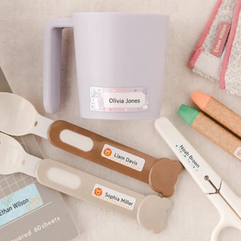 Name labels on a mug, cutlery, crayons, and everyday school items
